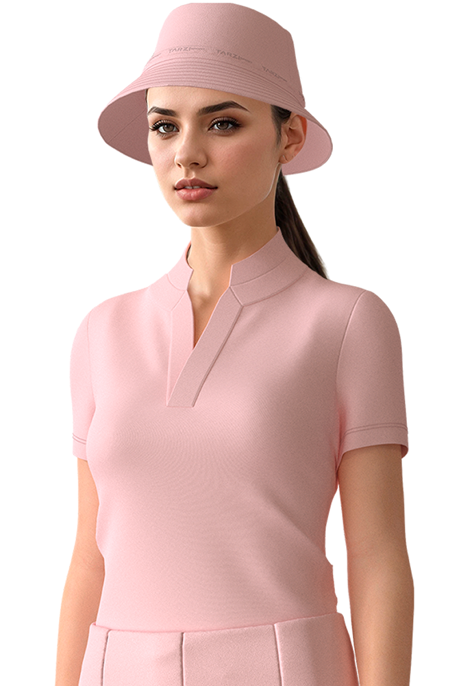 Woman wearing a pink outfit with a matching hat on a white background