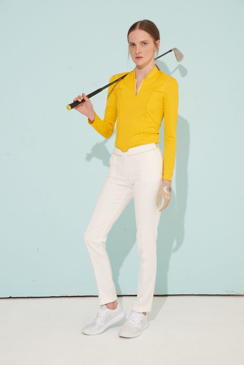 Tarzi Sport model wearing a long sleeve deesigner golf shirt and straight fit golf pants
